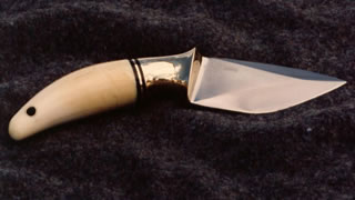 Blade 3/8" x 1 5/8" x 3 1/2" long, Forged 5160 Steel, Black Micarta spacers, Narwhal tooth handle