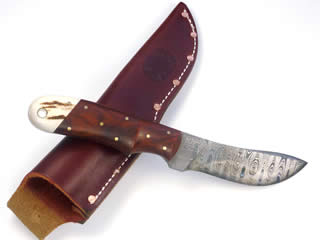 150 layer ladder pattern 3 3/4" long Damascus blade with Cocobolo and elk horn handle