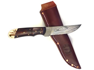 Twist pattern 3 3/4" long Damascus blade with Cocobolo and elk horn handle